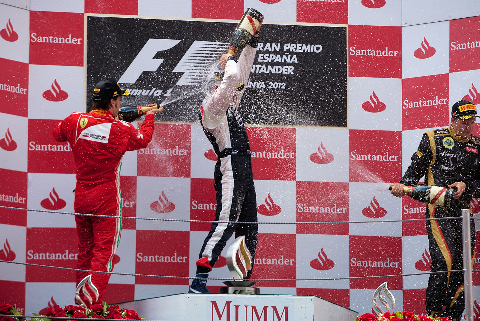 A victorious Pastor Maldonado of Williams showers with champagne on the podium after winning the Spanish Grand Prix 2012