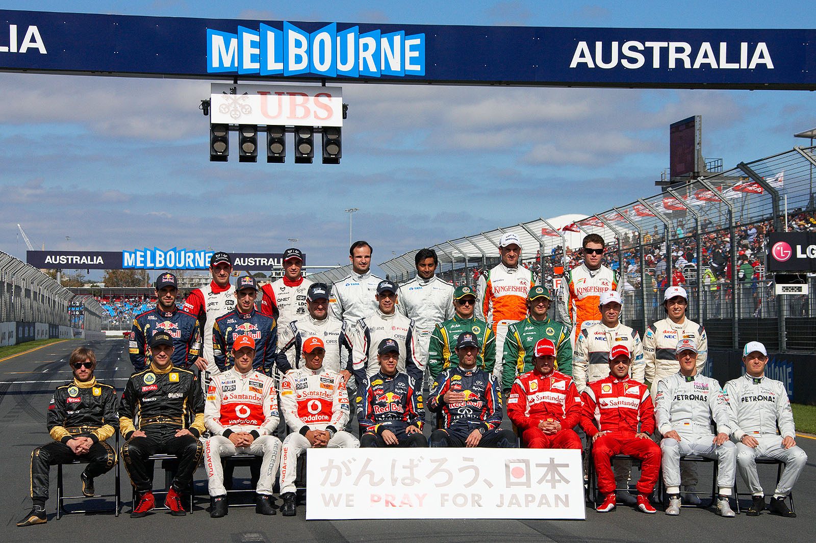F1 season 2011 annual drivers presentation group photo, this year's motto is 'We pray for Japan'