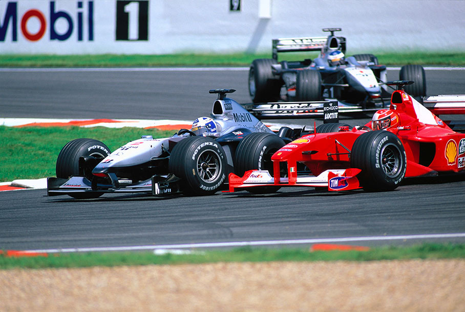 David Coulthard overtakes Michael Schumacher in Adelaide curve, followed by Mika Hakkinen