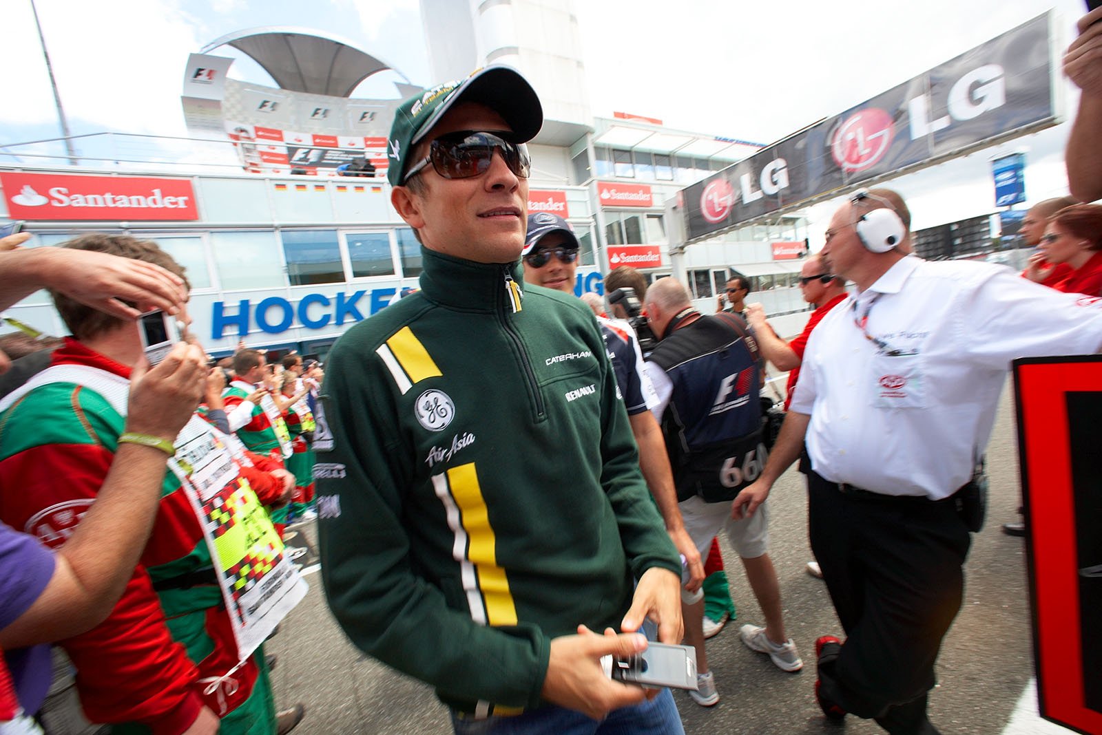 Vitaly Petrov of Caterham on his way to drivers parade