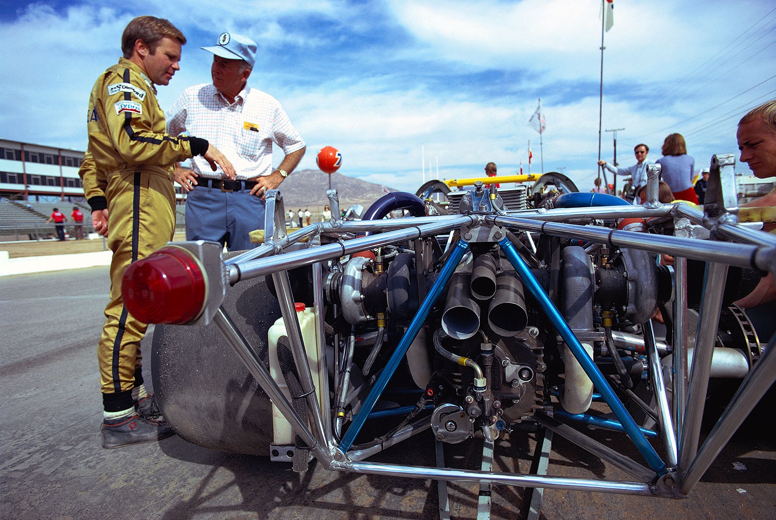 Mark Donohue beside his Porsche 917