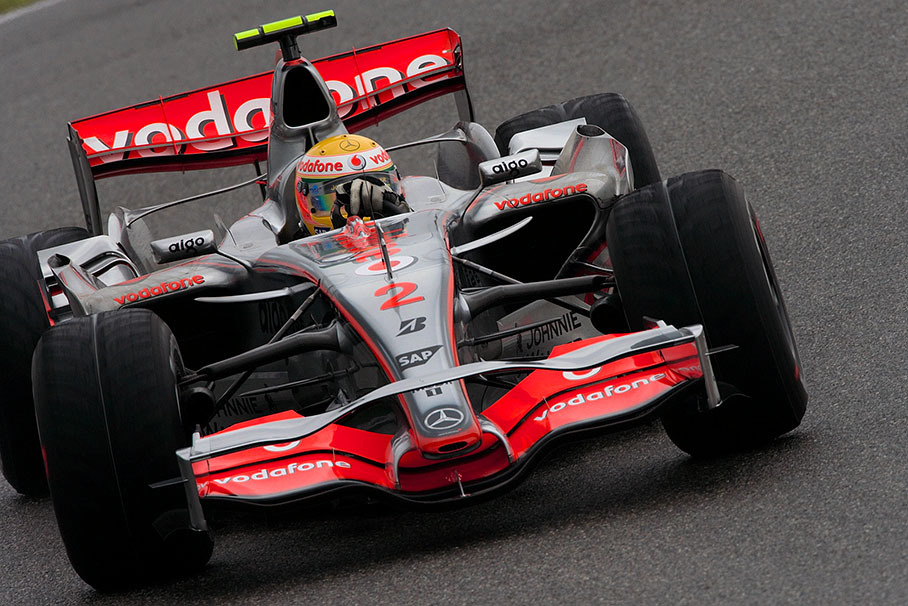 Lewis Hamilton drifts on wet track