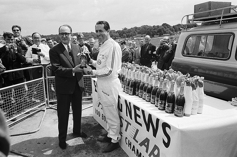 Jack Brabham wins 100 bottles of champagne for doing the fastest lap during qualifying for the British GP in Brands Hatch 1966