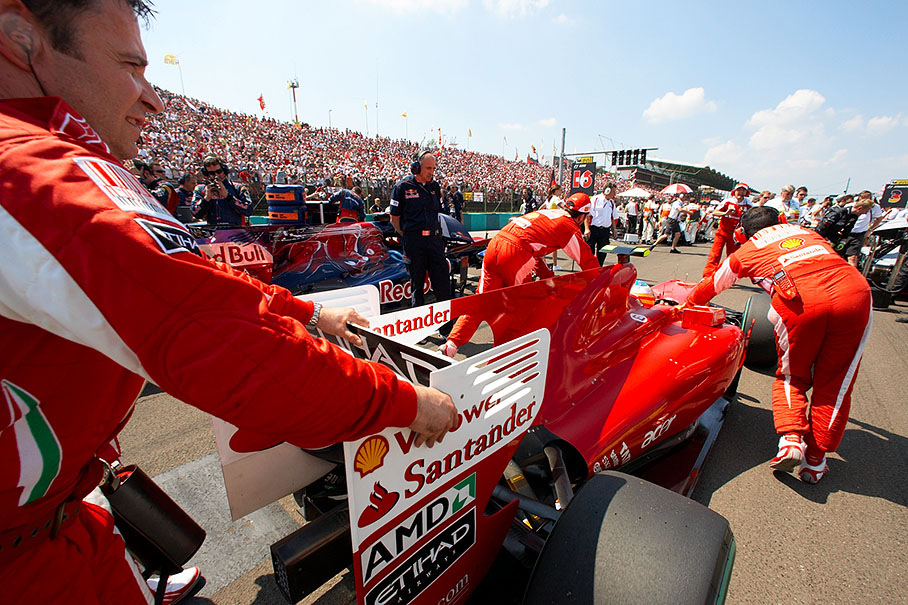 Fernando Alonso, Ferrari, is pushed to third grid place