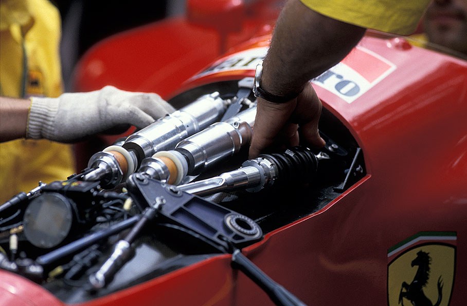 Ferrari mechanics prepare Berger's suspension