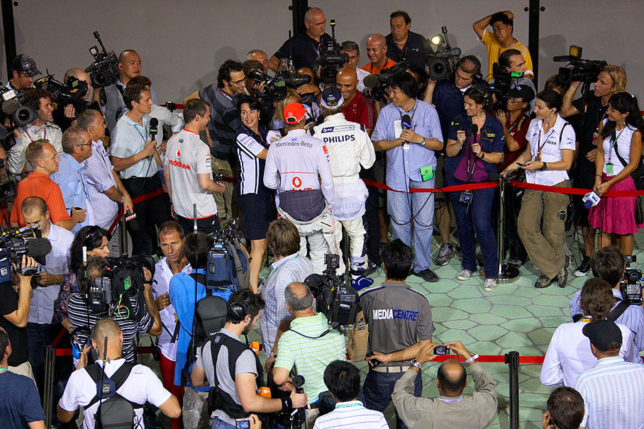 During a post qualifying TV interview, polesitter Hamilton jokes around with third qualifier Nico Rosberg
