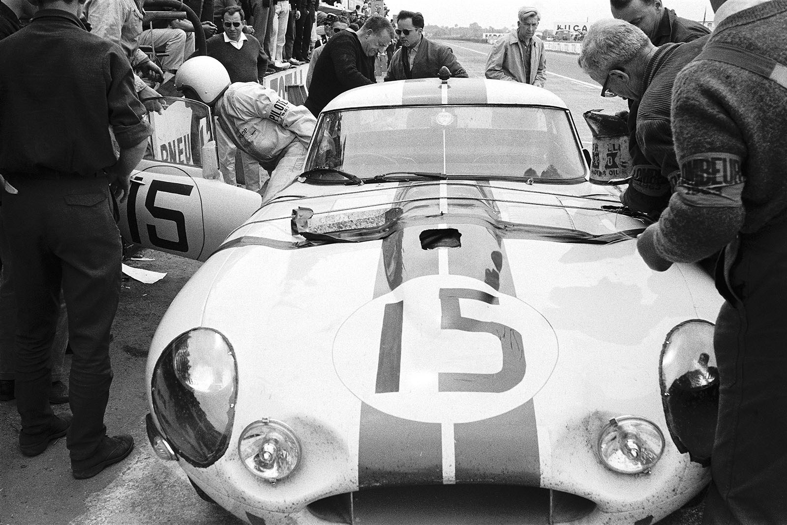 Briggs Cunningham's and Bob Grossman's Jaguar E-type Lightweight (#S850664 5115 WK) becomes second in the GT+3.0 classement - despite a long unplanned stop after a crash making a replacement of the front hood necessary.