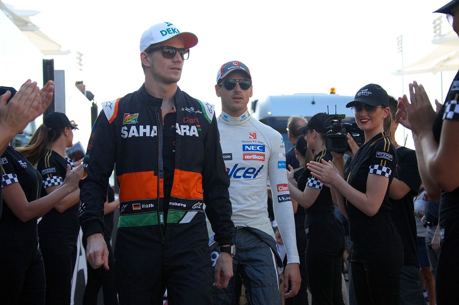 Hulkenberg and Sutil on the way to drivers presentation group shot, Abu Dhabi Grand Prix, 2014