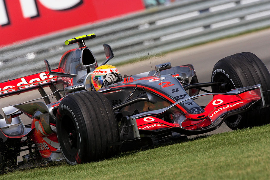 Lewis Hamilton, McLaren Mercedes, mowes the lawn after braking too late