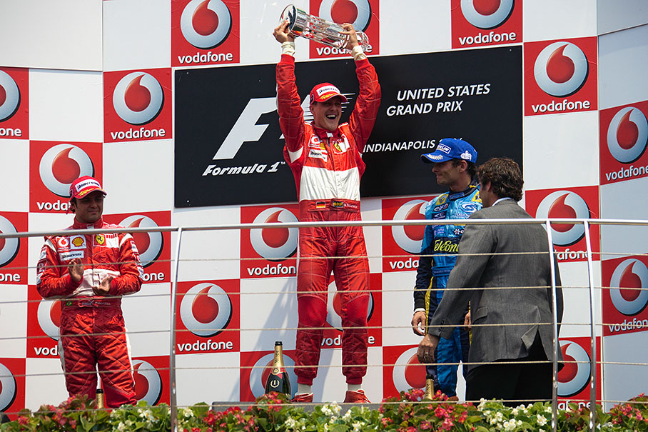 Michael Schumacher proudly presenting his trophy