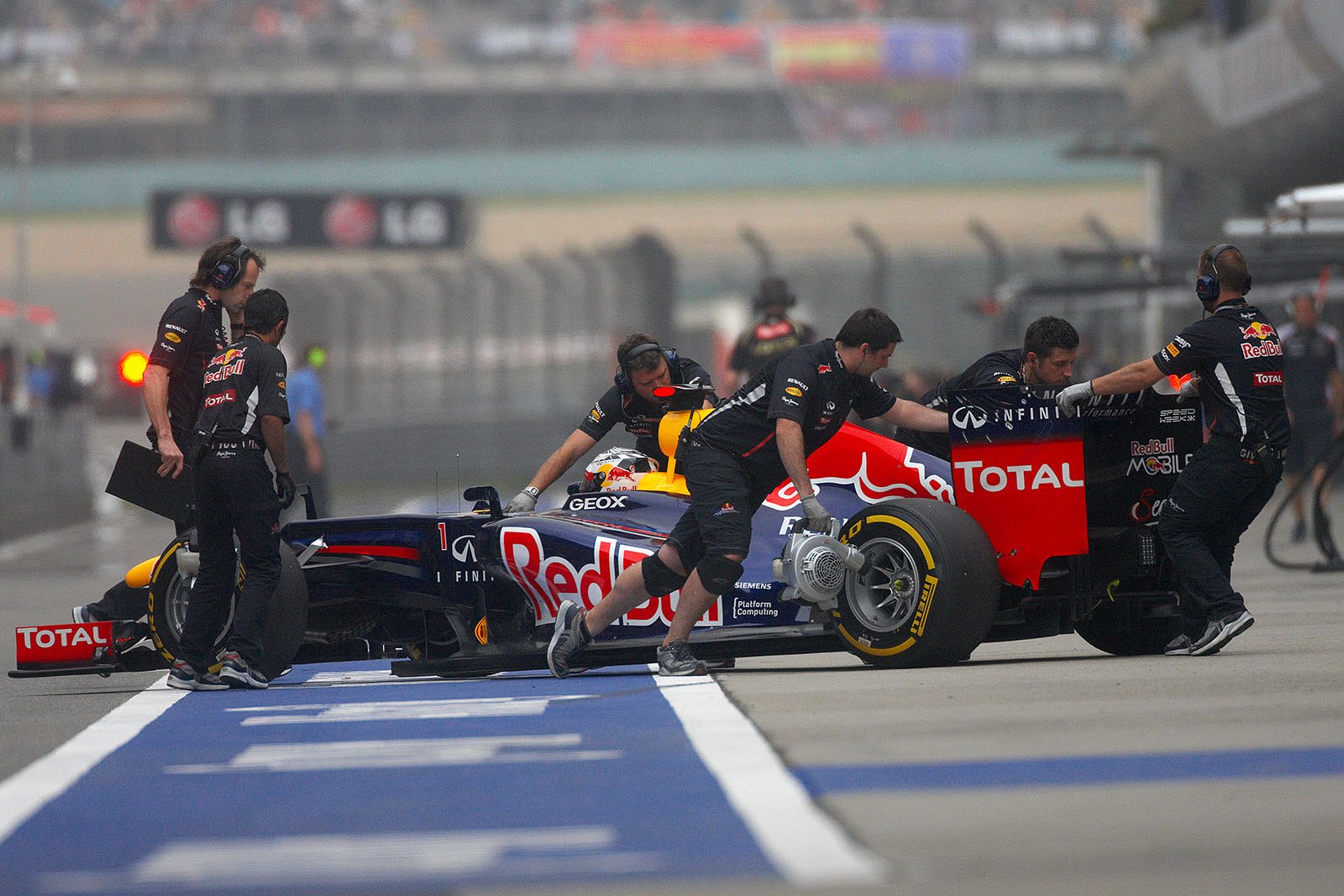 Sebastian Vettel is reversed to Red Bull Racing pits after the session
