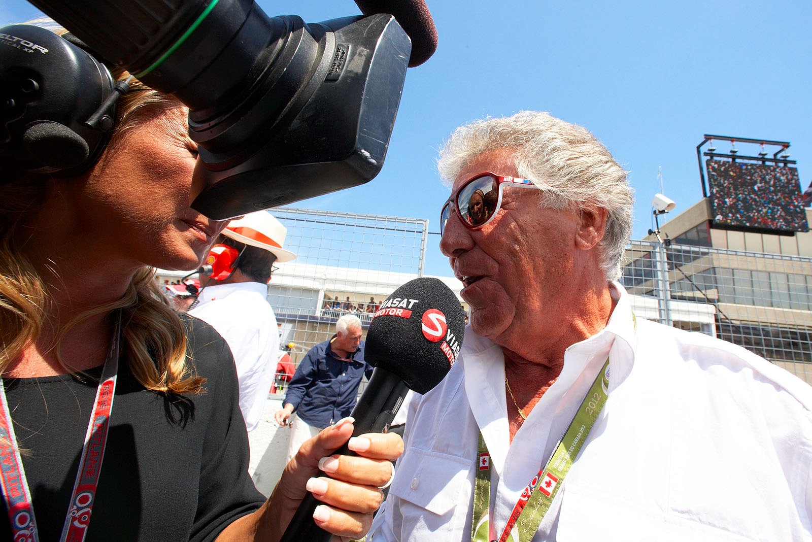 Mario Andretti, Formula One World Champion 1978, is interviewed on the grid in Montreal