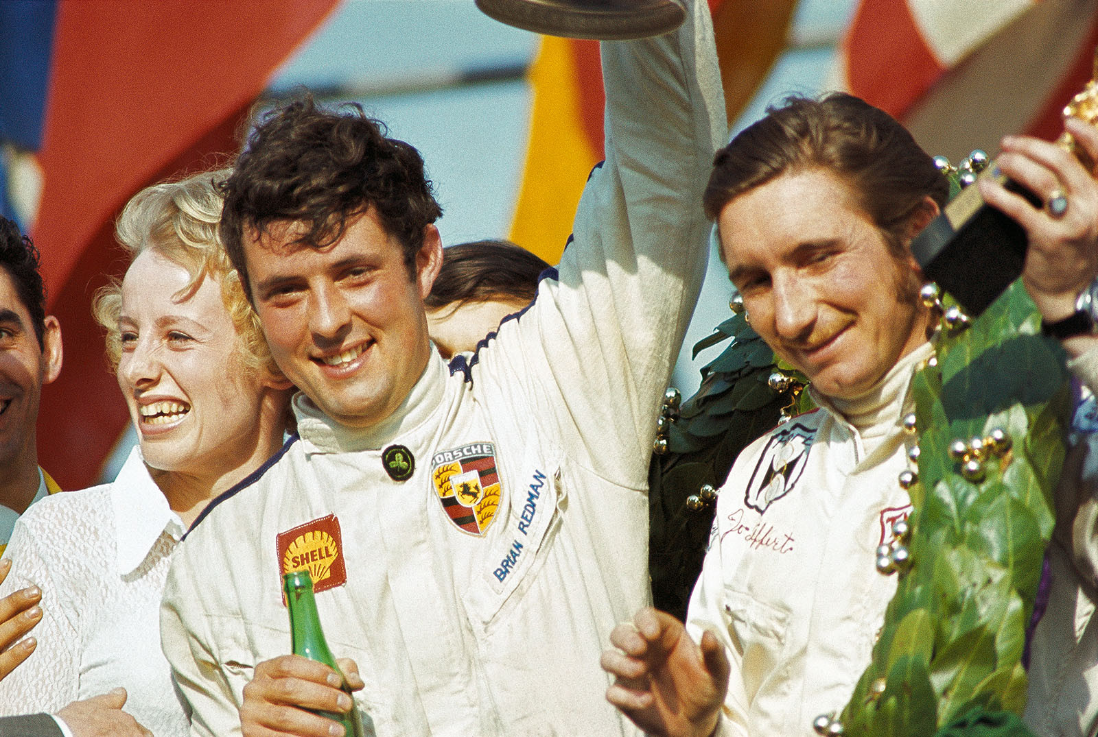 Jo Siffert (CH, right hand) and Brian Redman (GB) celebrate their victory after 1000kms on Monza's podium in 1969