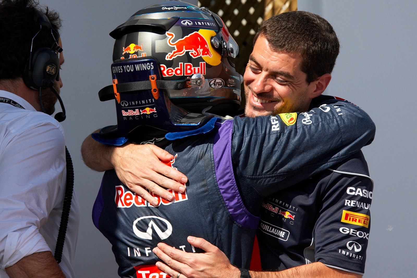 Race winner Sebastian Vettel of Red Bull Racing celebrates in parc ferme and hugs his race engineer Guillaume Rocquelin