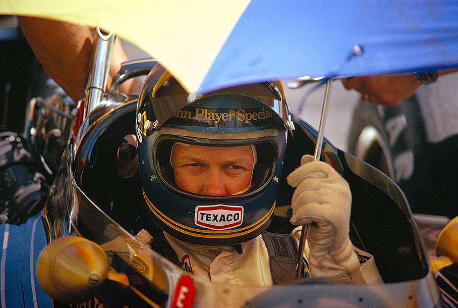 Lotus driver Ronnie Peterson waits in his cockpit during a practice session
