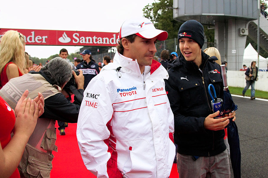Timo Glock with Sebastian Vettel