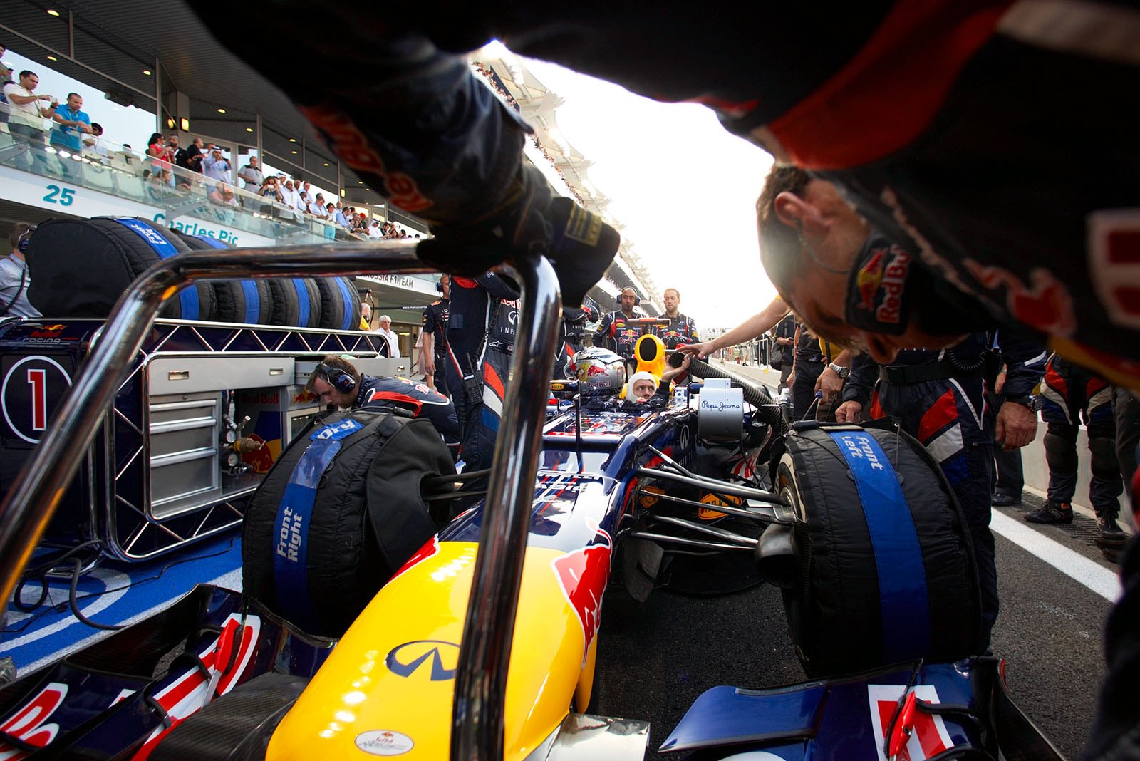 Sebastian Vettel's Red Bull Racing car is prepared in the pitlane