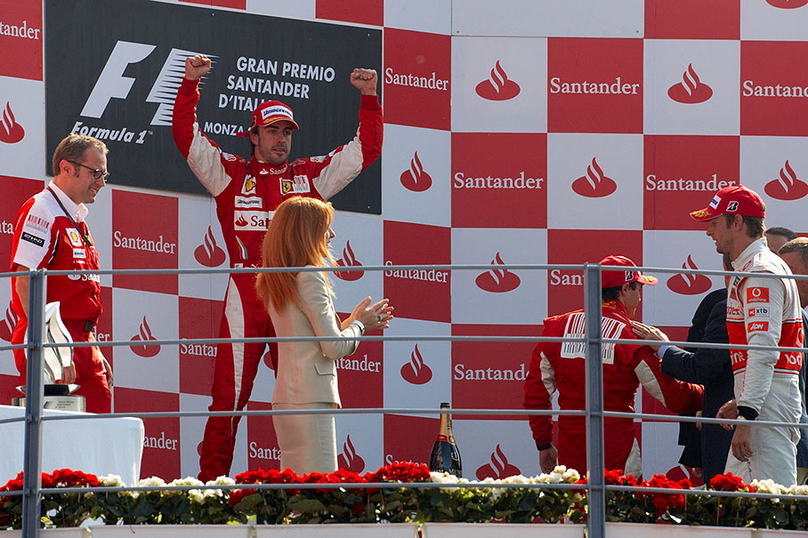 Race winner Fernando Alonso celebrates on the podium
