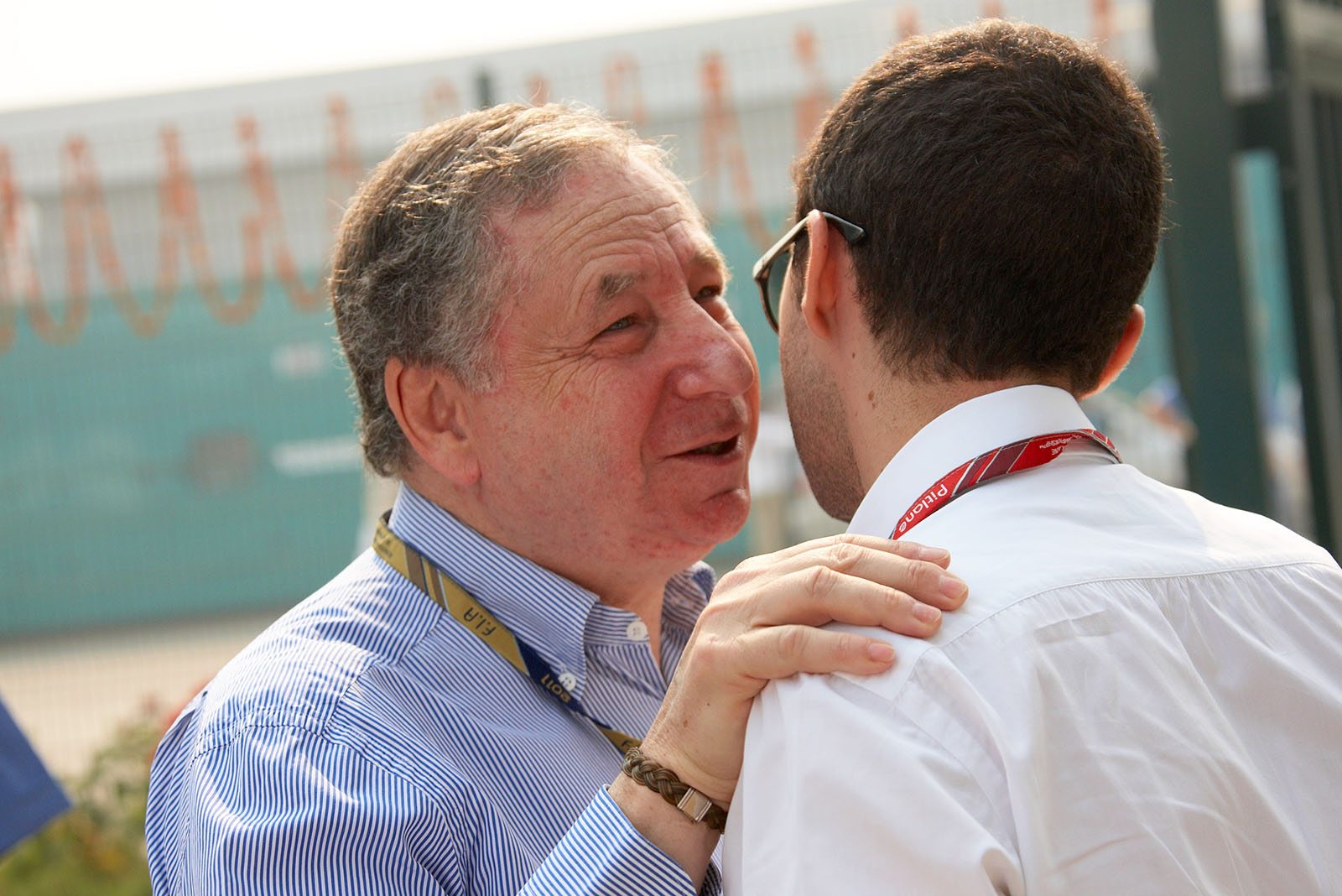 FIA president Jean Todt hispers into his son Nicola's ear
