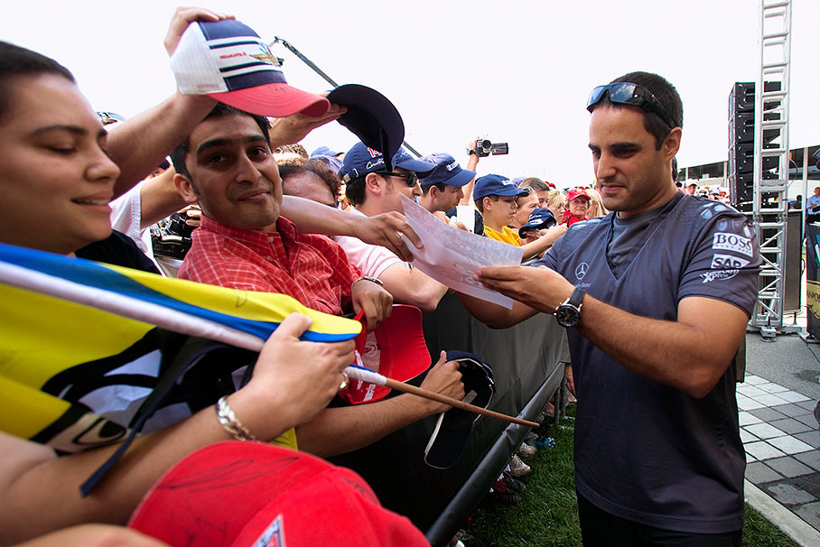 Juan Pablo Montoya performing an autograph session for his American fans