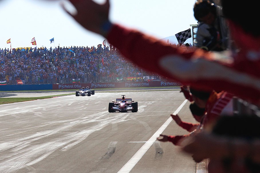 Race winner Felipe Massa being welcomed by his cheering team to his first F1 victory ever