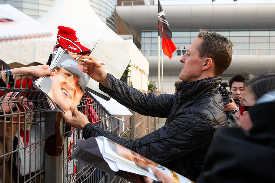 Michael Schumacher signs autographs to his devoted Chinese fans