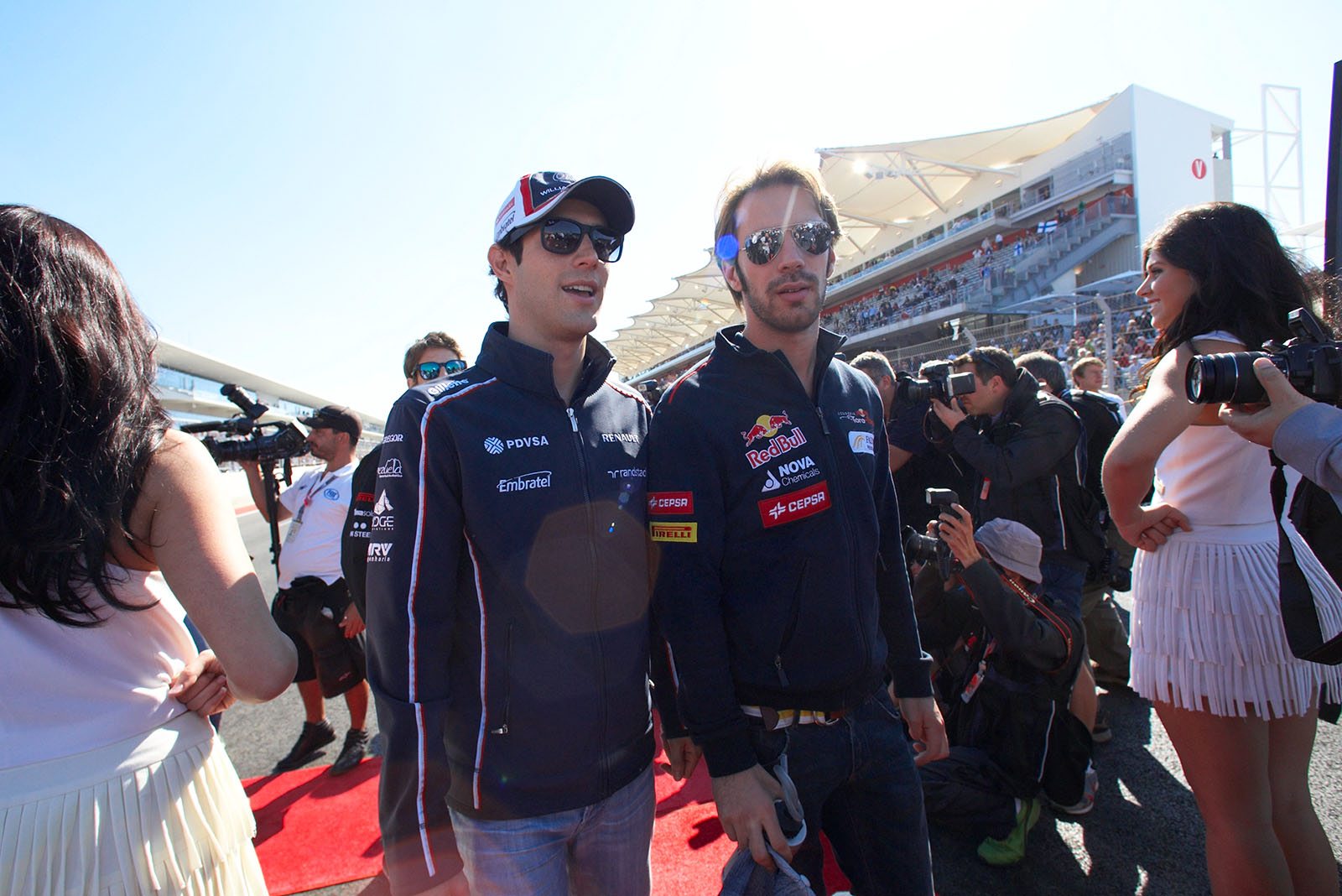 Bruno Senna of Williams and Jean-Eric Vergne of Toro Rosso walk to drivers presentation