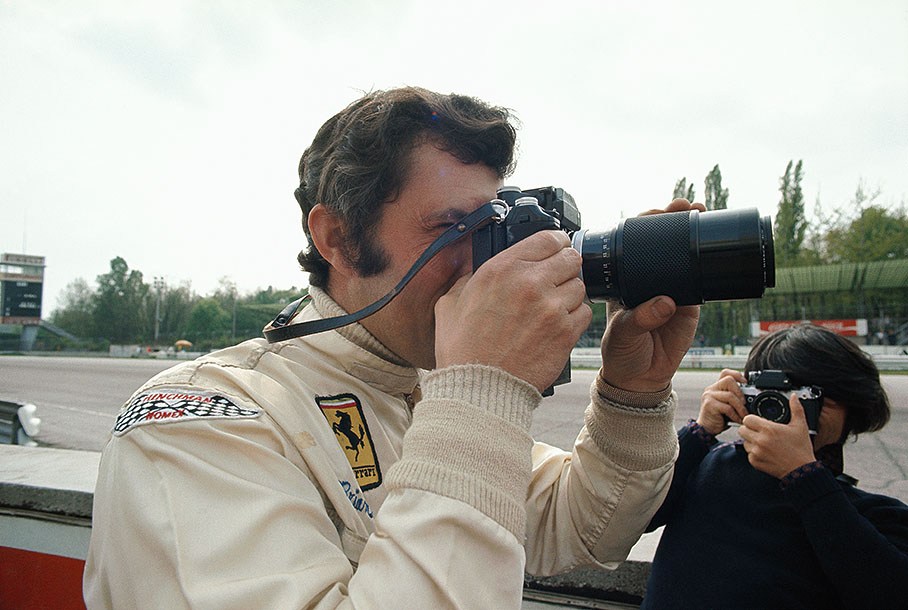 Brian Redman looks through a professional camera
