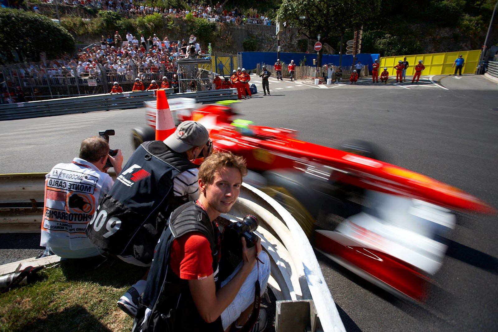 Photographers getting as close to the cars as it gets in modern F1.
