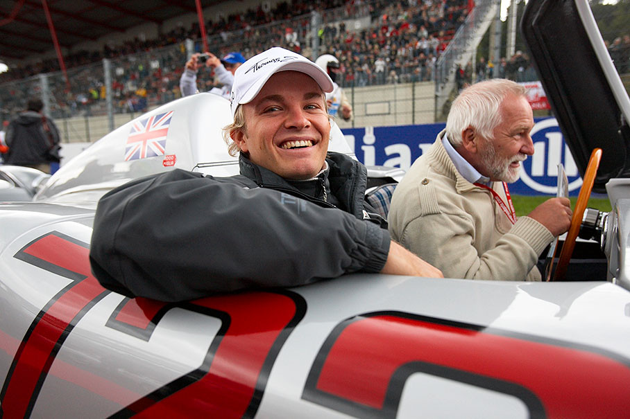 Nico Rosberg enjoys a ride in a Mercedes silver arrow W196 numbered '722'