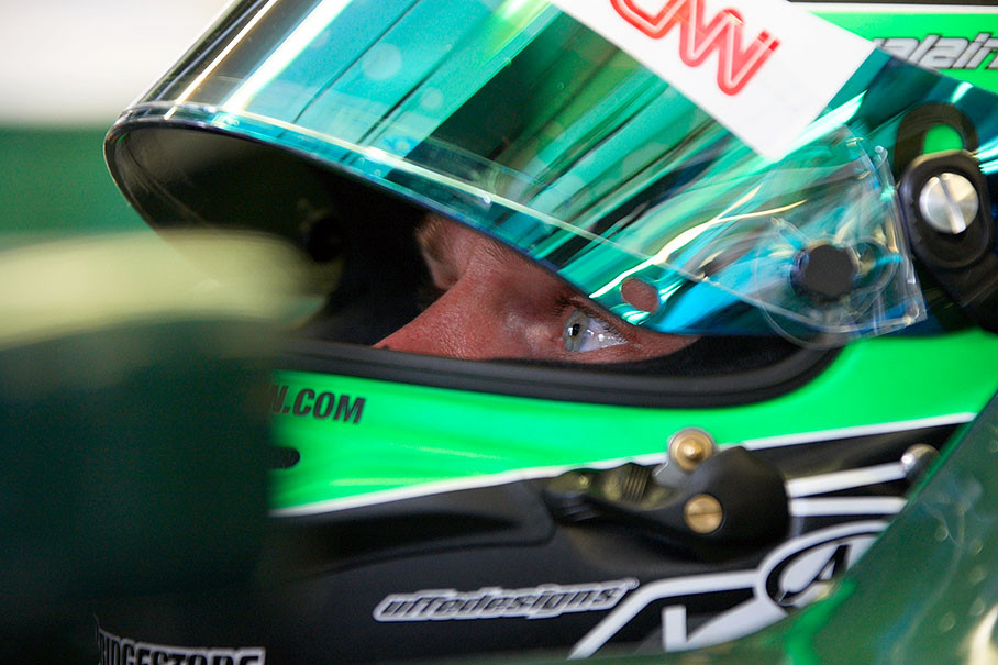 Heikki Kovalainen, Lotus Racing, watches the times during a practice session