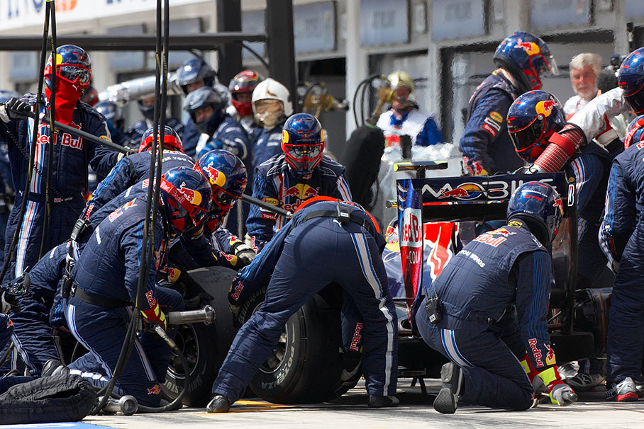 Sebastian Vettel is being serviced at Red Bull Racing pits
