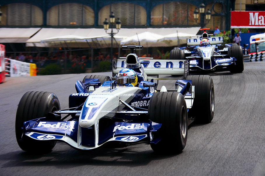 Nick Heidfeld and Mark Webber chase their Williams FW27-BMW P85 cars around Monaco's Casino during the 2005 GP, becoming 2nd and 3rd placed behind winner Raikkonen