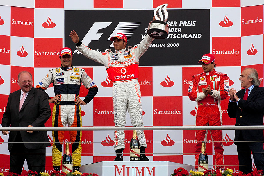 Race winner Lewis Hamilton presents his trophy