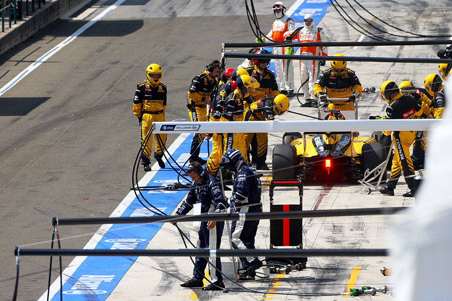 Robert Kubica in Renault pits to serve a stop-and-go penalty for a collision with Sutil in the pitlane