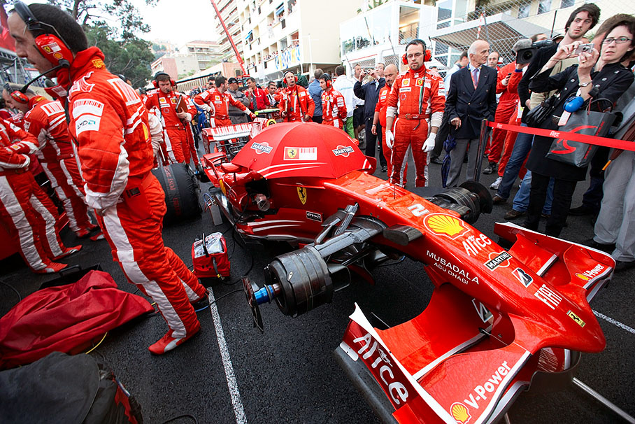 Massa's Ferrari on the grid, surrounded by engineers, mechanics and guests