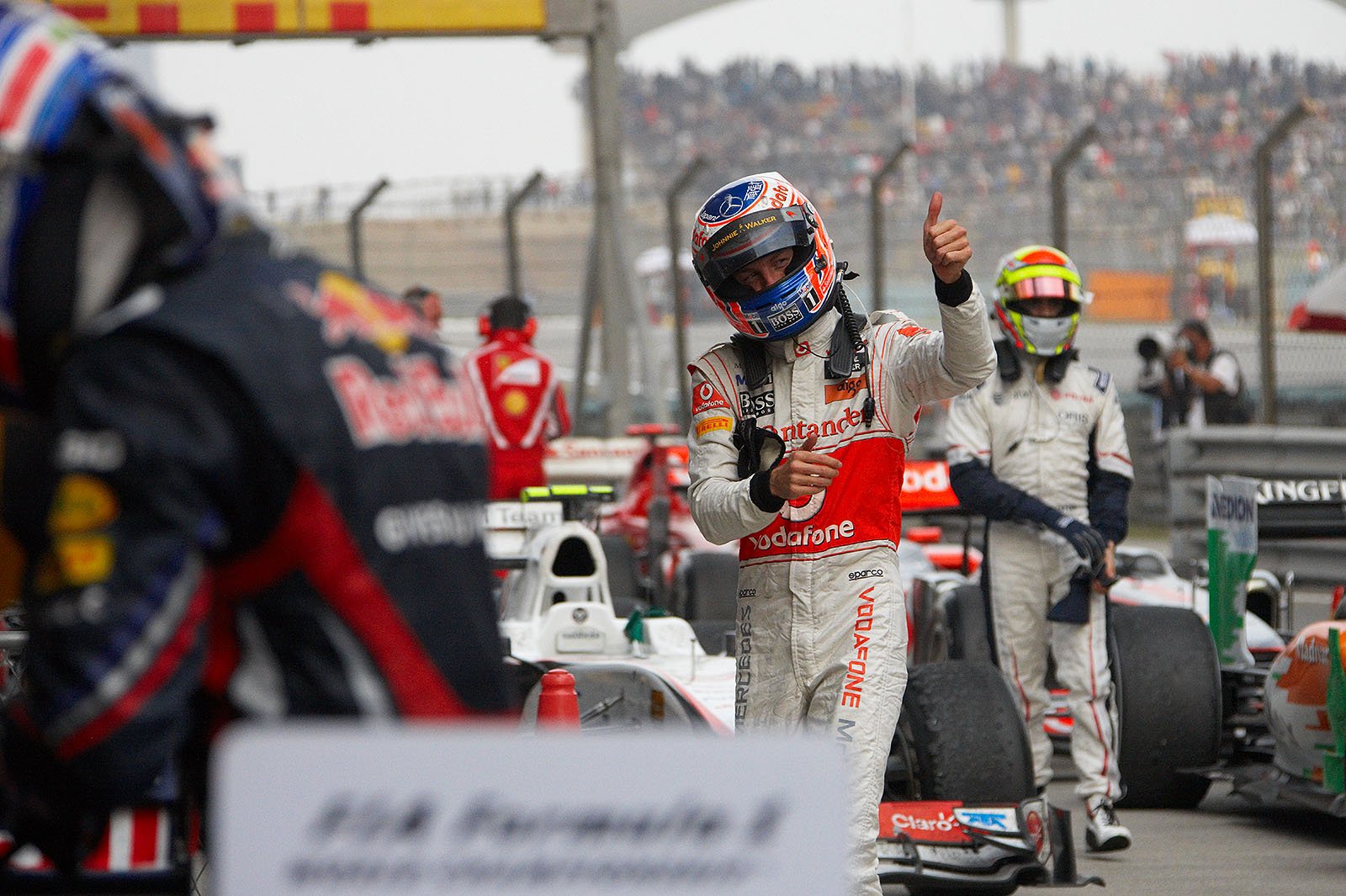 Fourth placed Jenson Button of McLaren in parc ferme after the Chinese GP