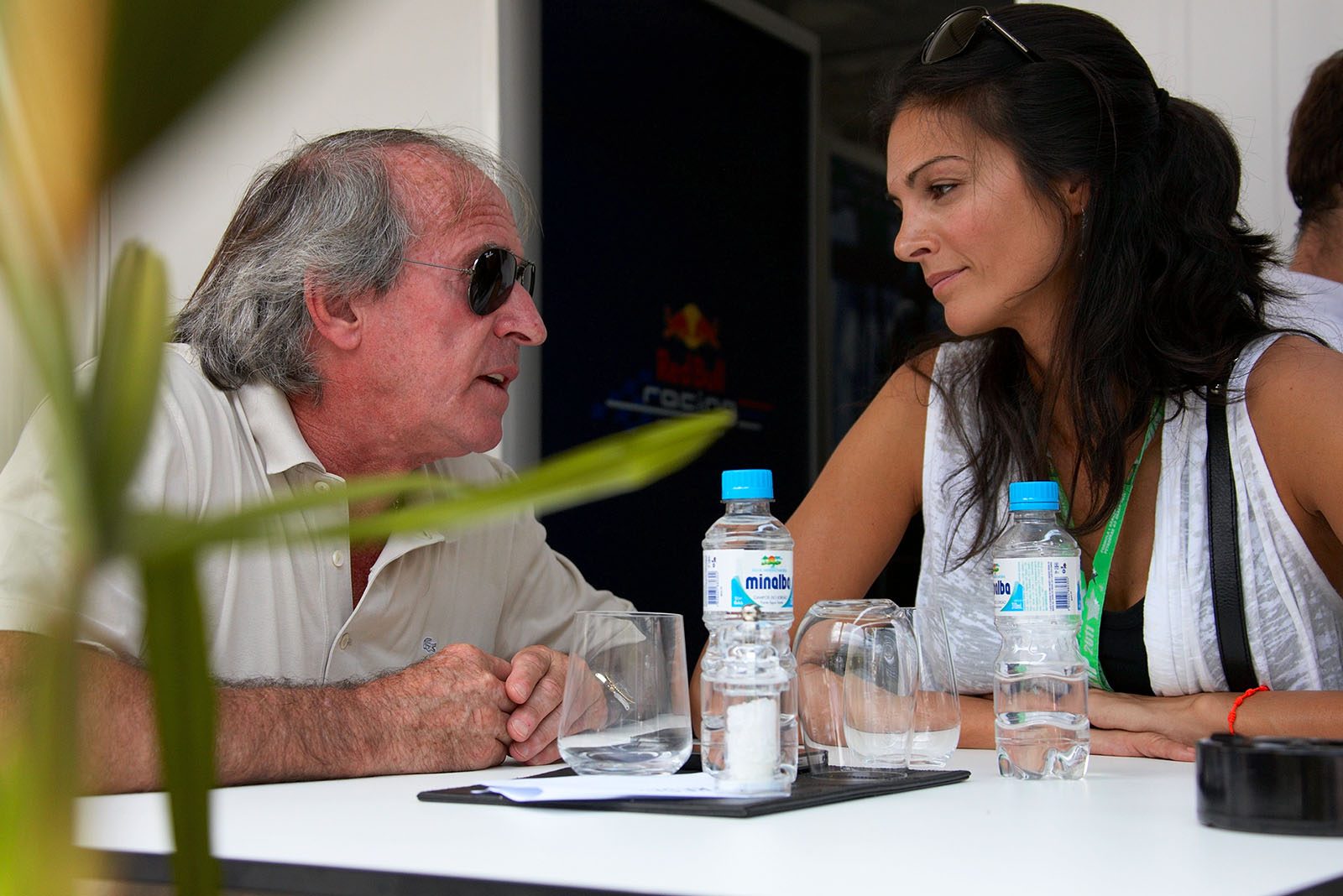 French racing legend Jacques Laffite chats with his colleague journalist Karen Minier, wife of David Coulthard