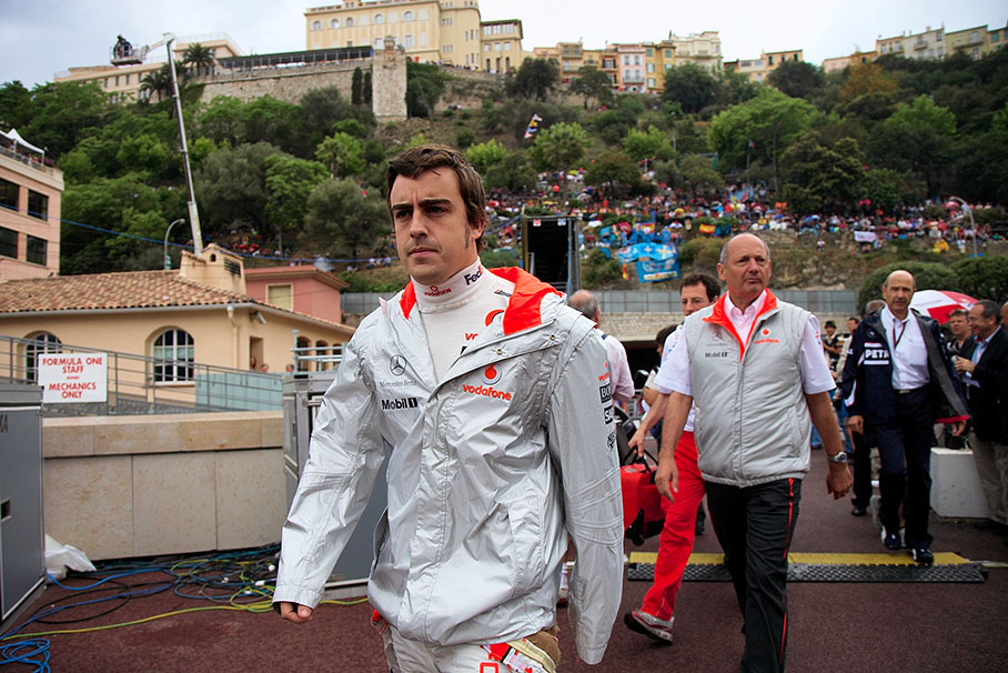 McLaren pilot Fernando Alonso followed by his boss Ron Dennis