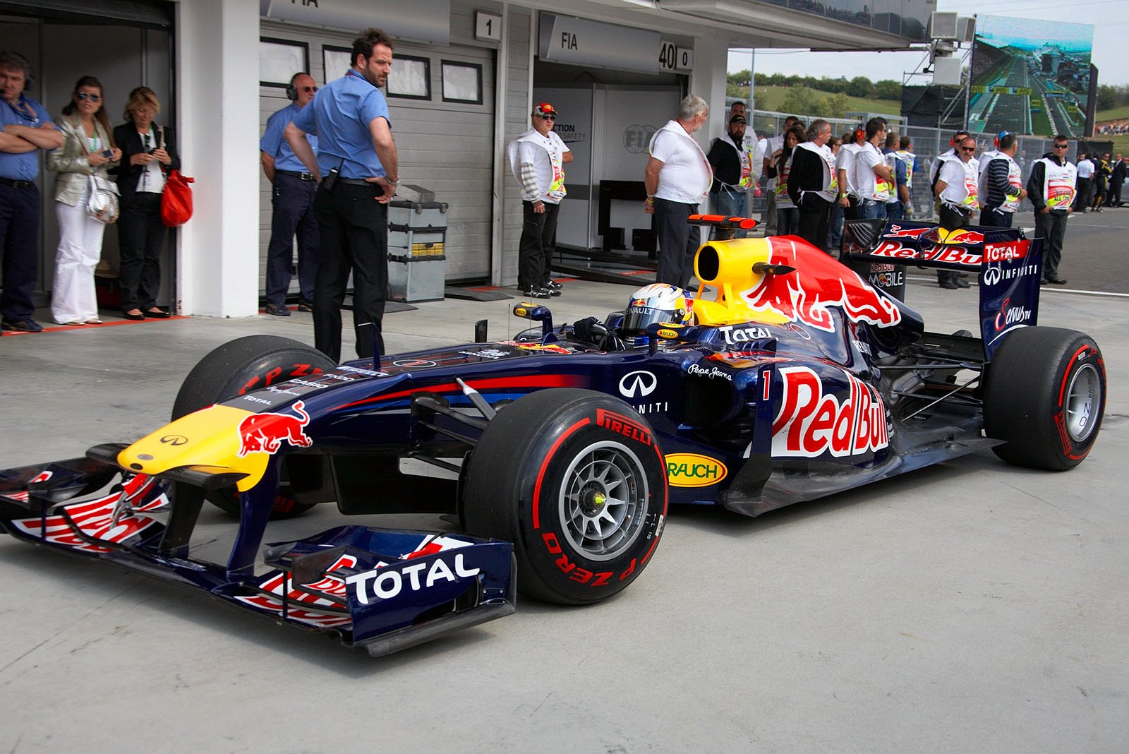 Polesitter Sebastian Vettel, Red Bull Racing, arrives at parc ferme after qualifying