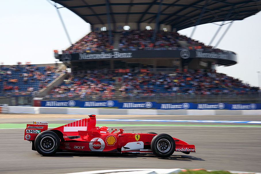 Michael Schumacher in front of the Mercedes-Benz grandstand, landmark at track segment "Mercedes-Arena"