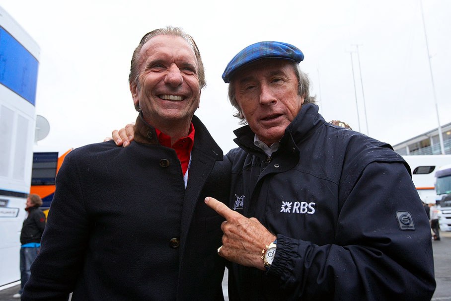 Double Formula One World Champion Emerson Fittipaldi and Triple Formula One World Champion Sir Jackie Stewart joke together for Rainer's lens