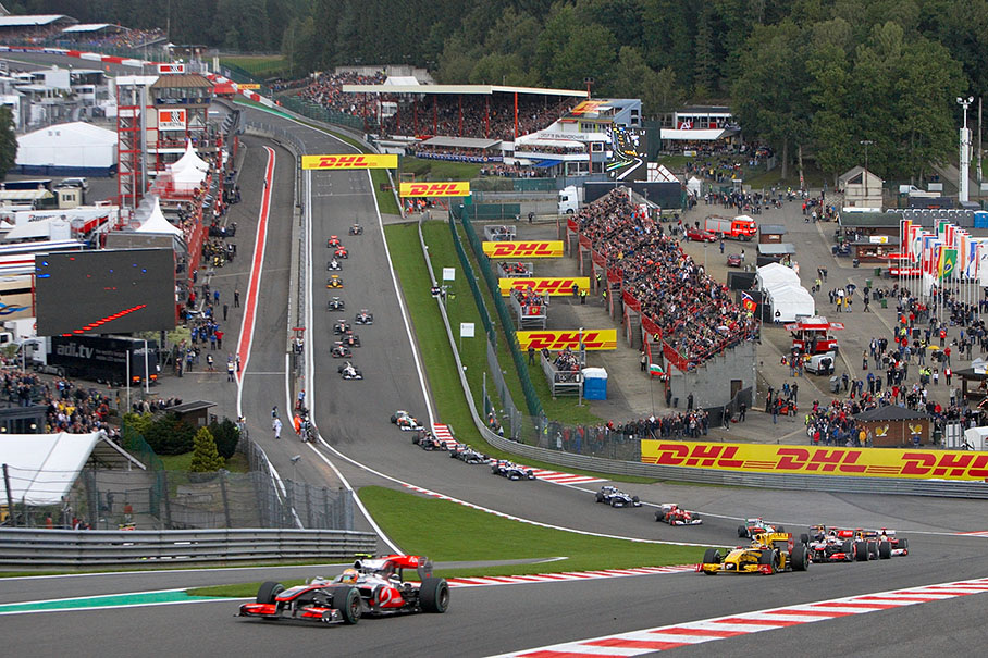 Lewis Hamilton leads the start field into Eau Rouge's chicane in front of Renault's Kubica and McLaren team mate Button