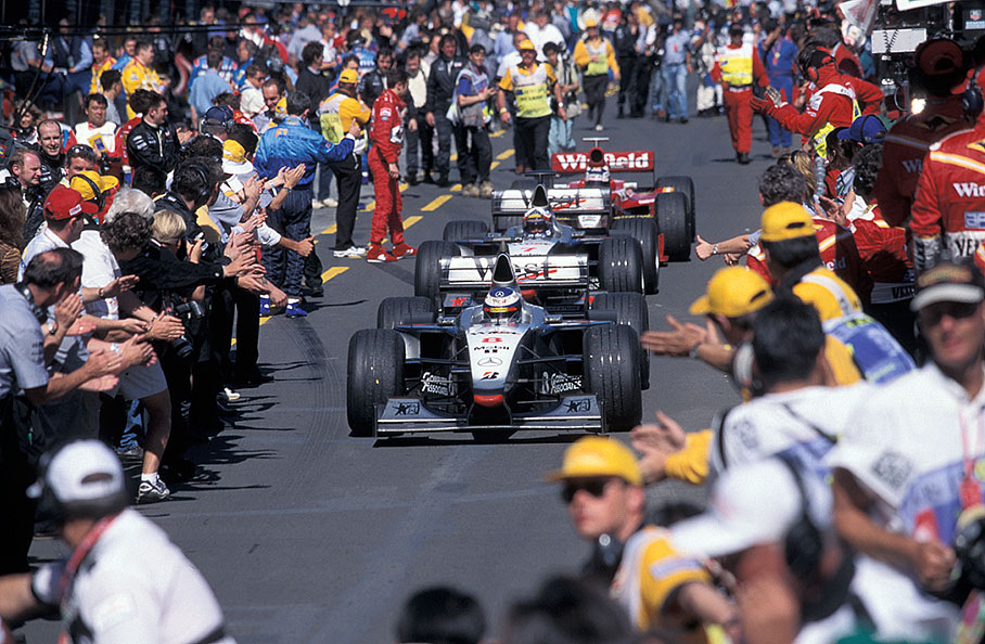 Mika Häkkinen leads the victorious McLarens 1-2 to parc fermé, followed by David Coulthard and Heinz-Harald Frentzen in his Williams