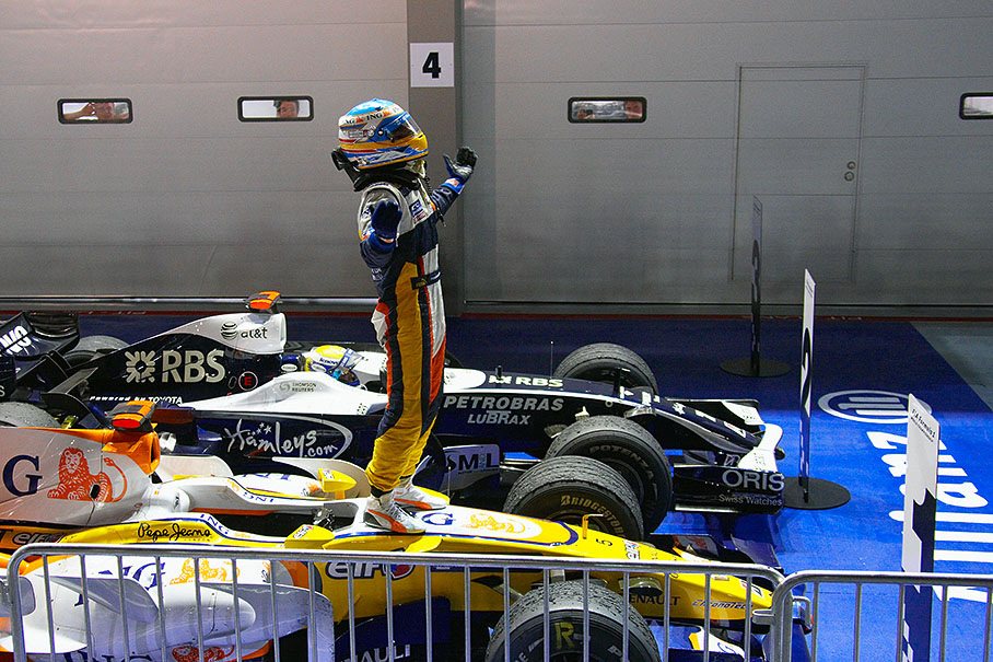 After arriving at parc ferme as an unpredicted winner, Fernando Alonso jumps on his Renault car and celebrates his proof of ability to still win races