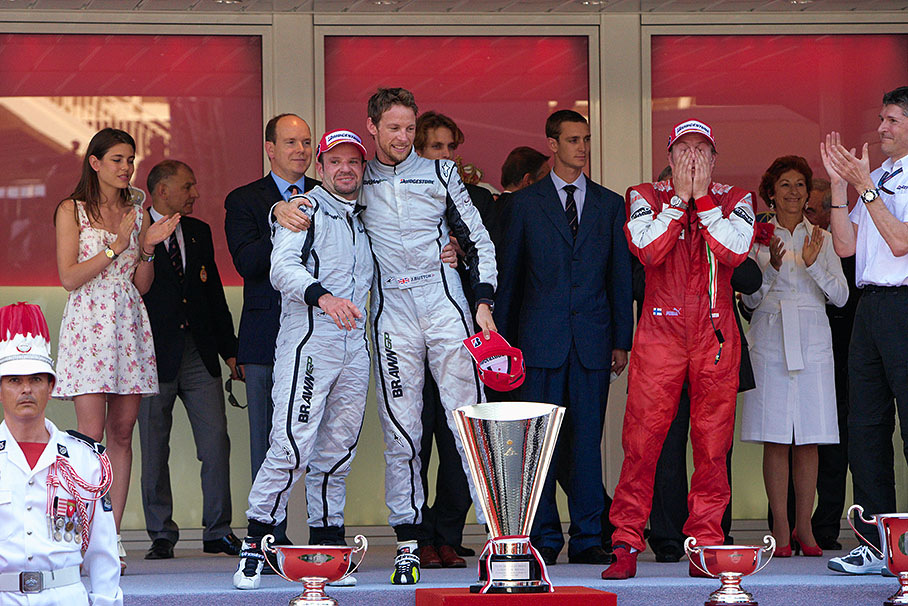 Second placed Rubens Barrichello and winner Jenson Button caress each during Monaco podium ceremony