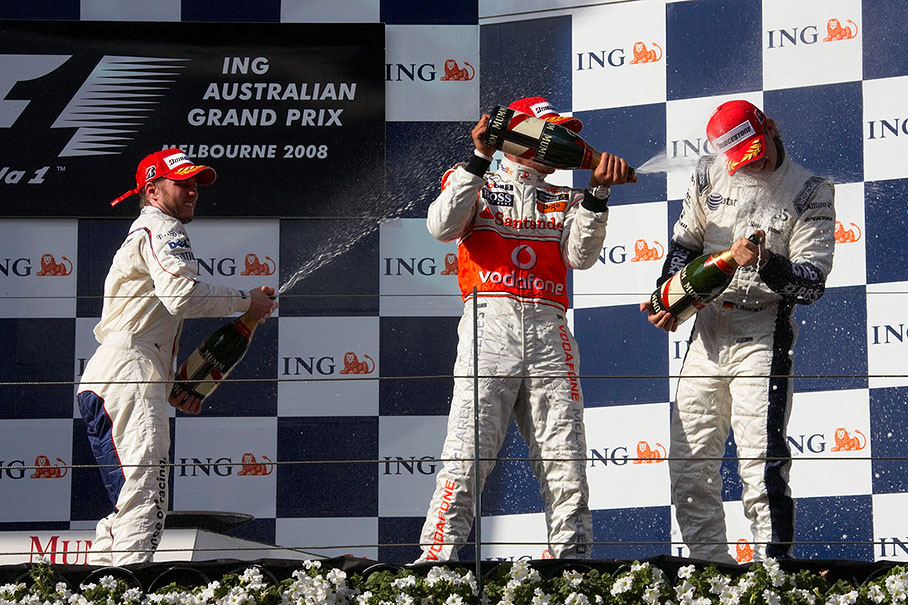 Champagne showers for second placed Heidfeld, winner Hamilton and third placed Rosberg.
