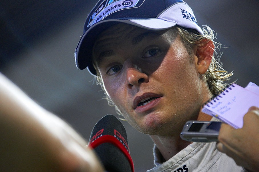 A delighted seconnd placed Nico Rosberg is being chased by press after the race