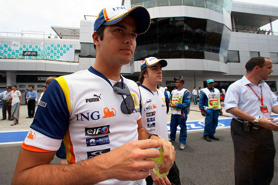 Nelson Piquet jr walks to drivers parade, Alonso behind him