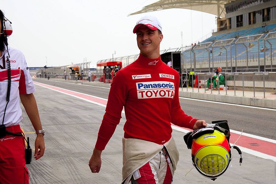 Ralf Schumacher walks to his workstation